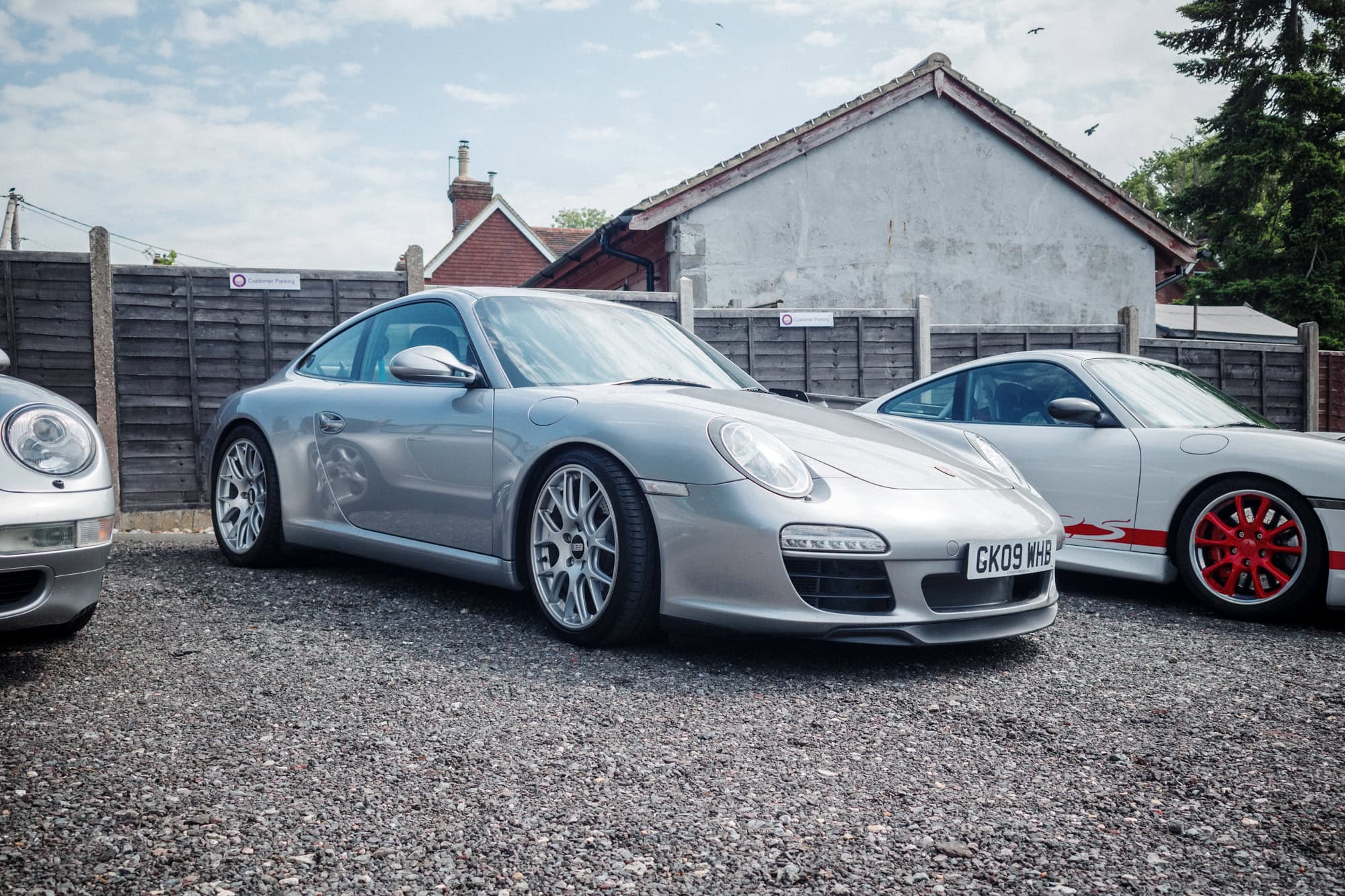 A silver Porsche 997 coupe on bbs alloy wheels at the hero motor company open day.