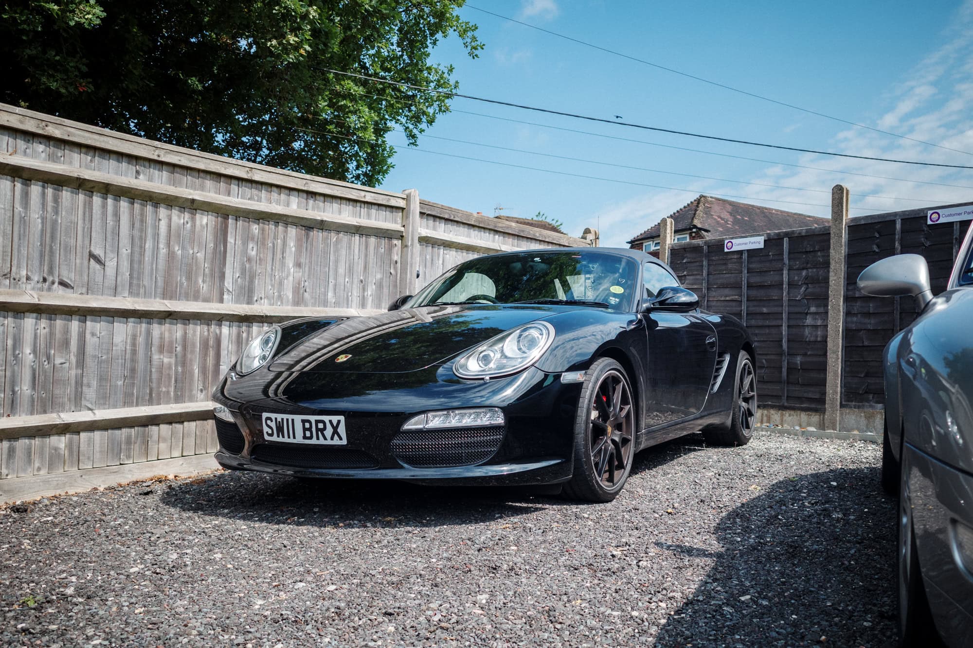A Porsche Boxster 987 black edition.