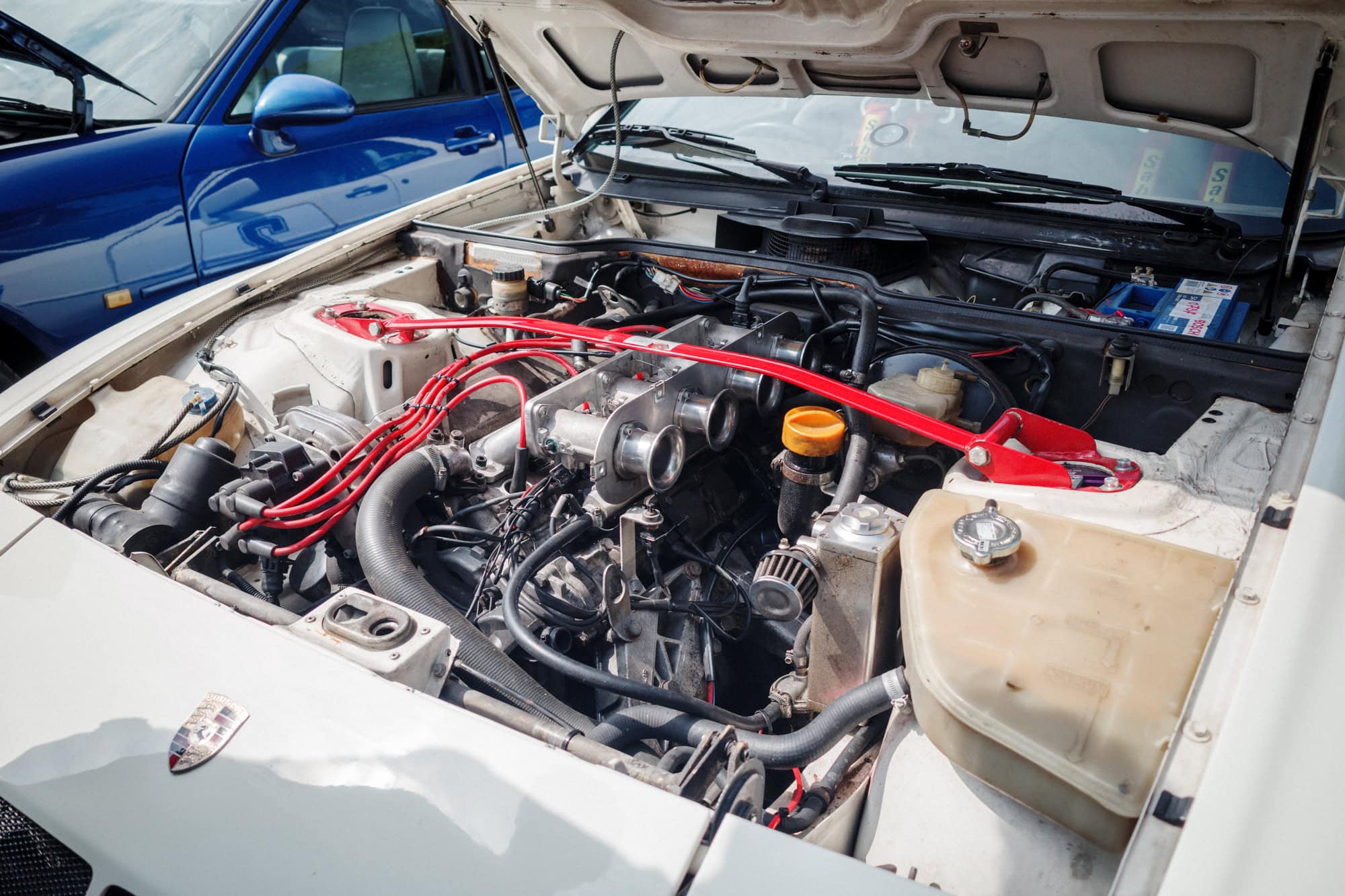 Throttle bodies on a Porsche 944 engine.