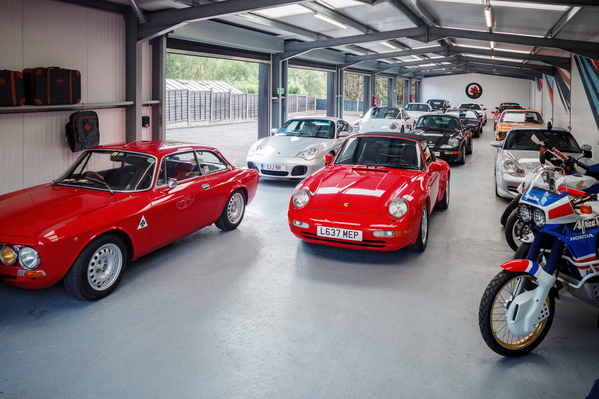 A collection of classic cars on display at an open day.
