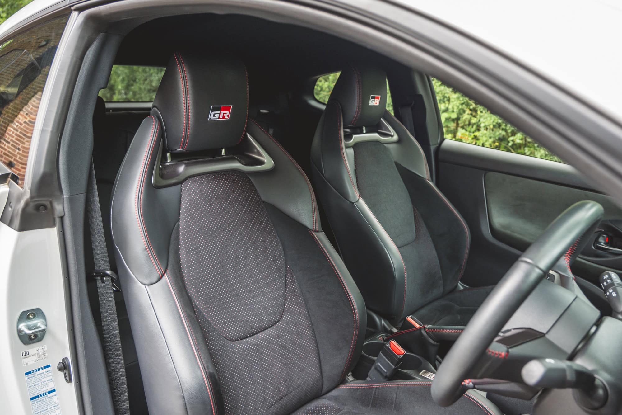 Interior view of the black sports seats of a Toyota Yaris GR Four.