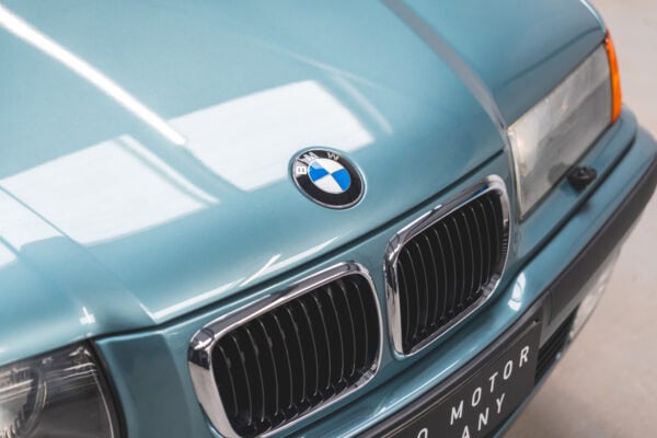 Close up view of BMW badge and front grill on a BMW 1997 E36 523 TDS