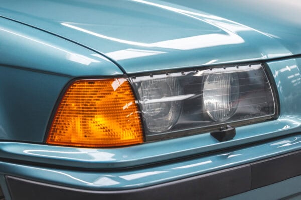 Close view on offside headlamp of a BMW 1997 E36 523 TDS