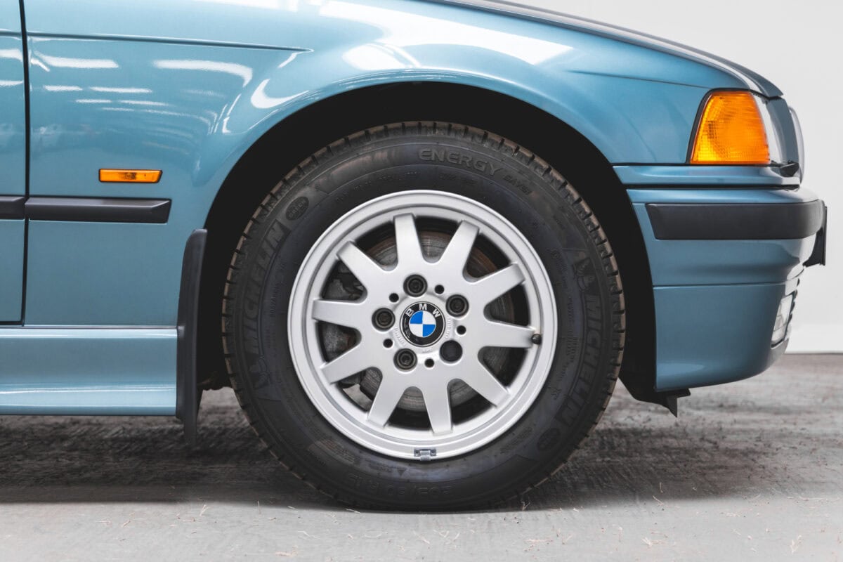 Offside front wing and alloy wheel on Morea Green BMW 1997 E36 523 TDS