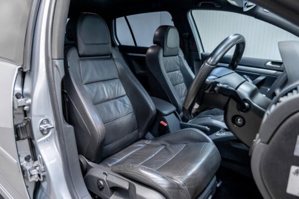 Offside interior view showing black leather seats and steering wheel Volkswagen Golf R32 Reflex Silver DSG