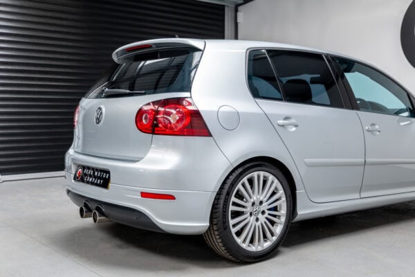 Offside rear exterior on Volkswagen Golf R32 Reflex Silver showing alloy wheel and exhaust