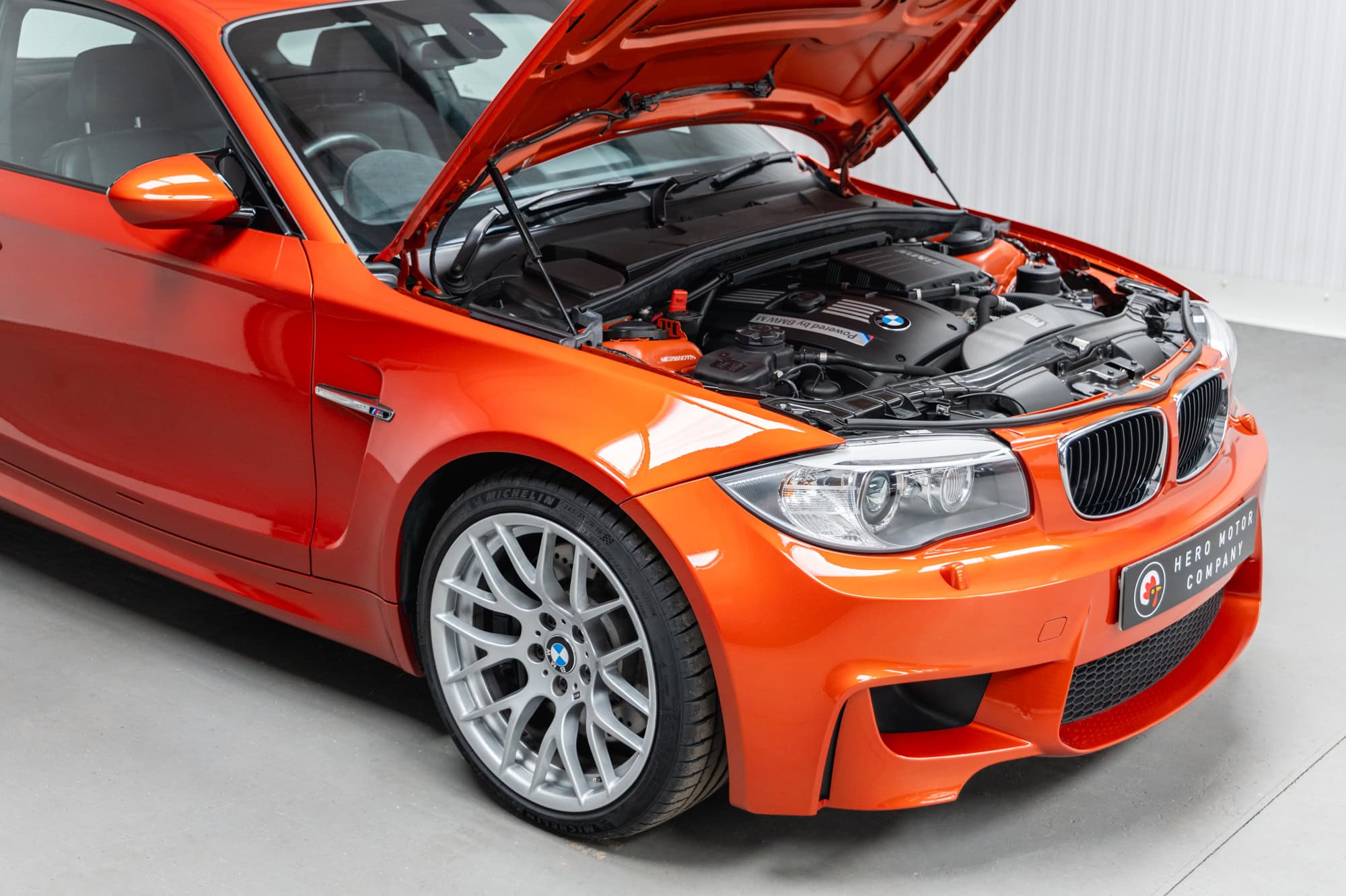 Front offside exterior bonnet up with view of engine bay on BMW E82 1M Coupe Valencia Orange