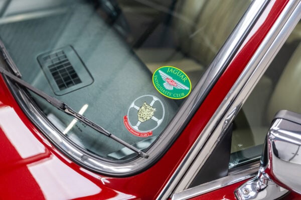 Chrome window trim and Jaguar stickers on 1985 Daimler Double Six Bordeaux Red Series 3 Saloon V12