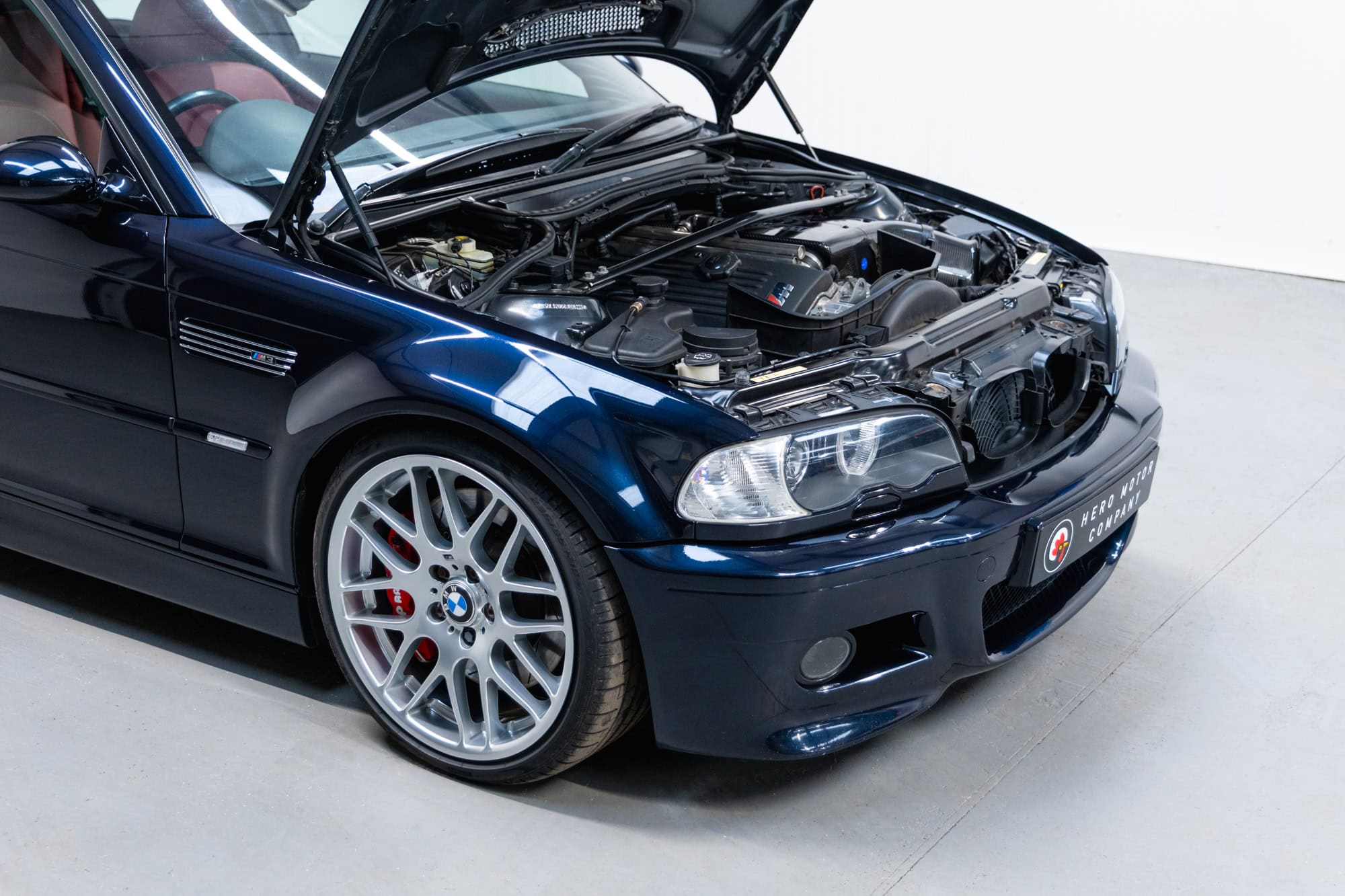 Offside exterior view of engine bay on BMW E46 M3 in carbon black with CSL alloy wheels and AP Racing brake Kit on Ohlins suspension with Karbonius CSL Carbon Airbox.