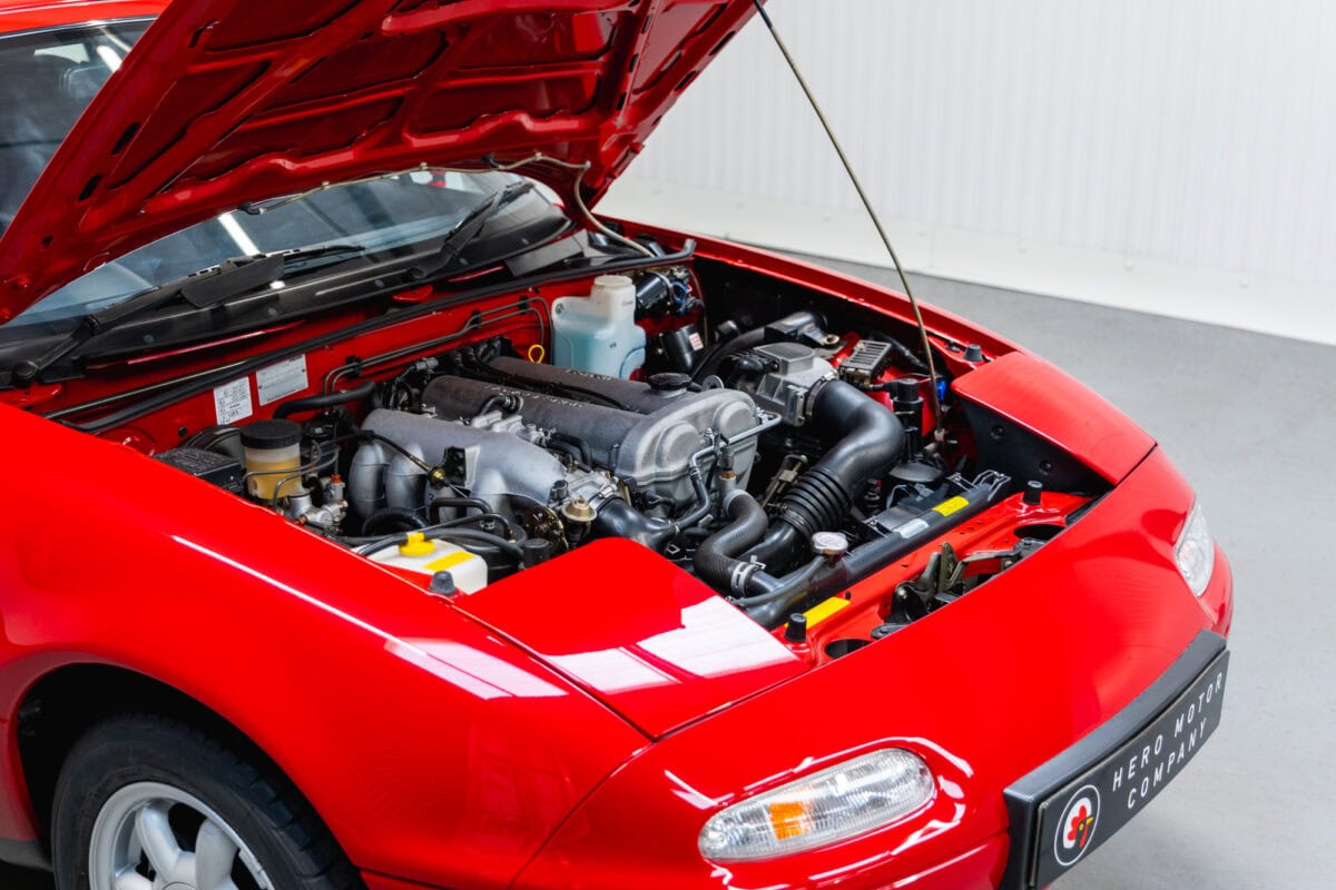 Offside view of engine bay with bonnet up on Mazda MX5 MKI Classic Red Eunos Roadster