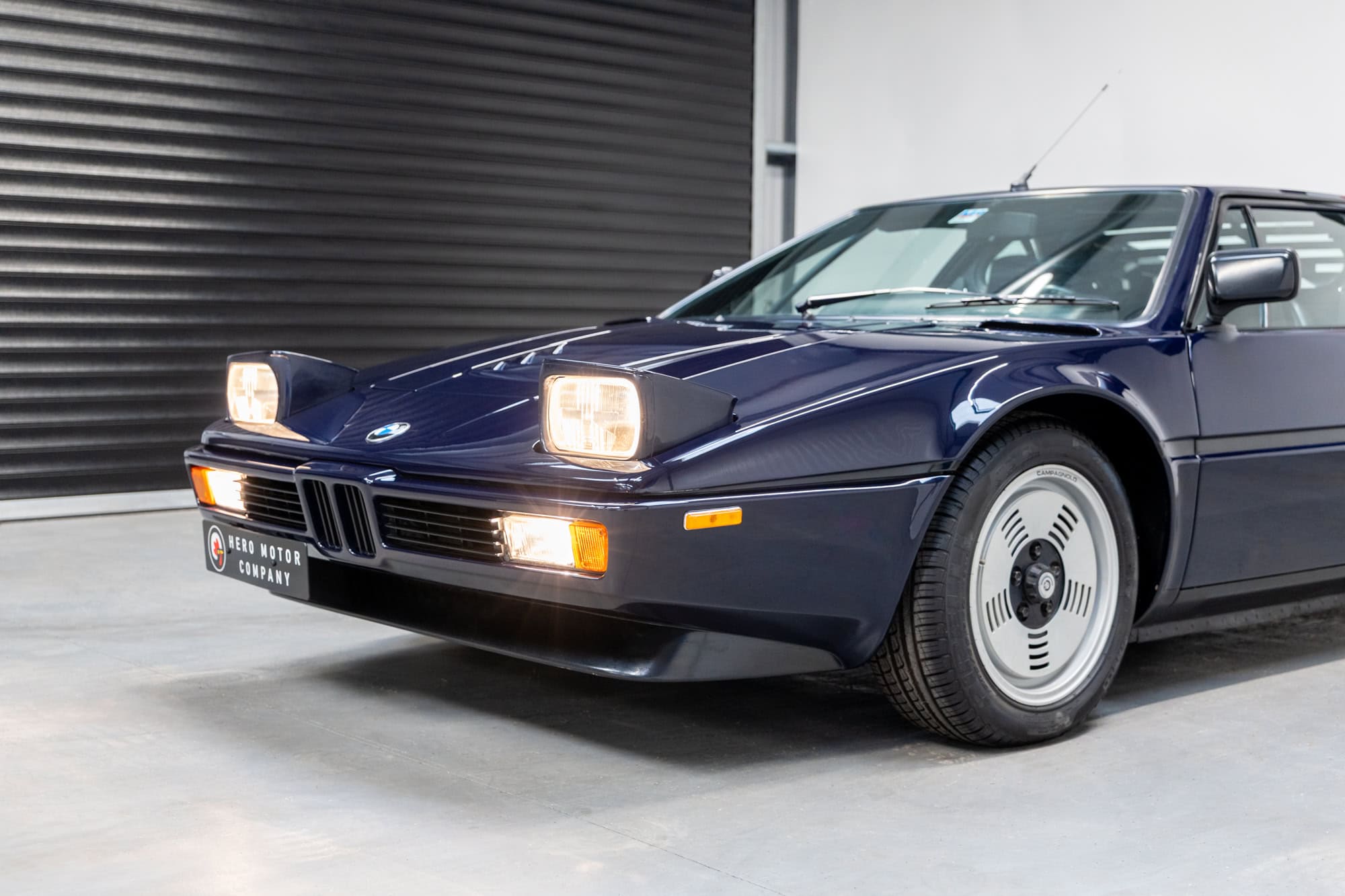 Nearside exterior view of BMW E26 M1 1980 Nicht Blau with headlamps up