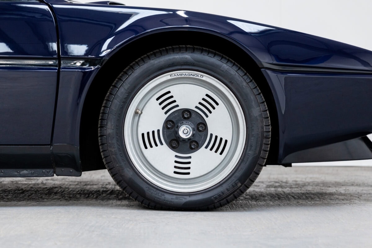 View of Campagnolo alloy and offside front front quarter on BMW E26 M1 1980 Nicht Blau