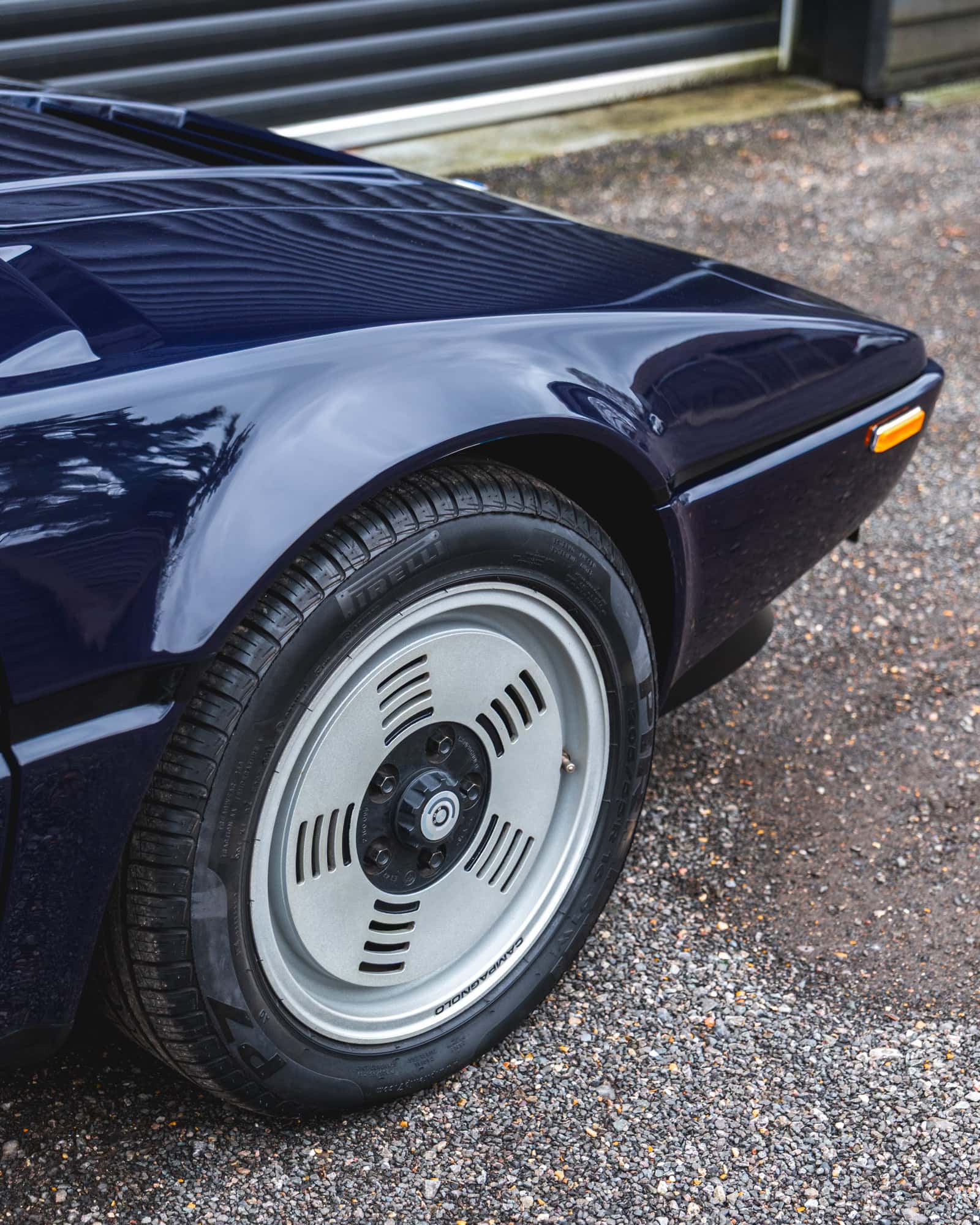 Offside front quarter of 1980 E26 BMW M1 Nachtblau showing alloy wheel
