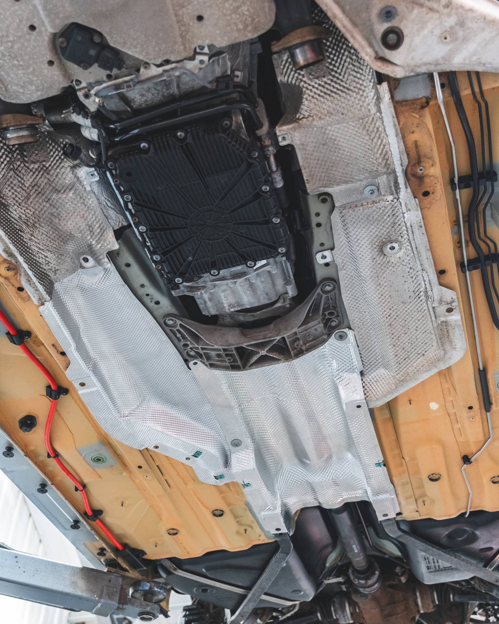 Underside of BMW E90 M3 showing heatshields