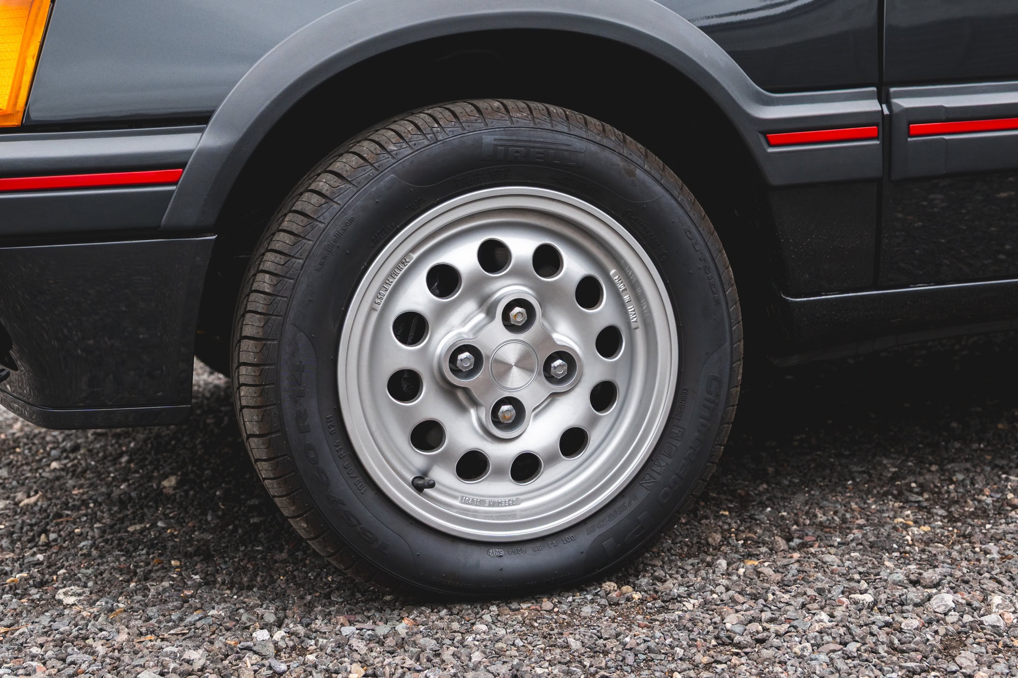 View of alloy wheel and bodywork on Gris Graphite Peugeot 205 GTI