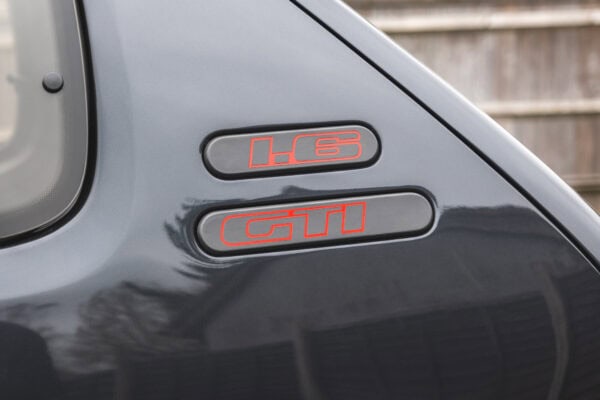 Landscape close up view of 1.6 GTI badge on Gris Graphite Peugeot 205 GTI
