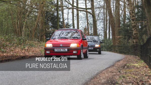 A grey 1.6 Peugeot GTI chases a red 1.9 Peugeot GTI down a country road.