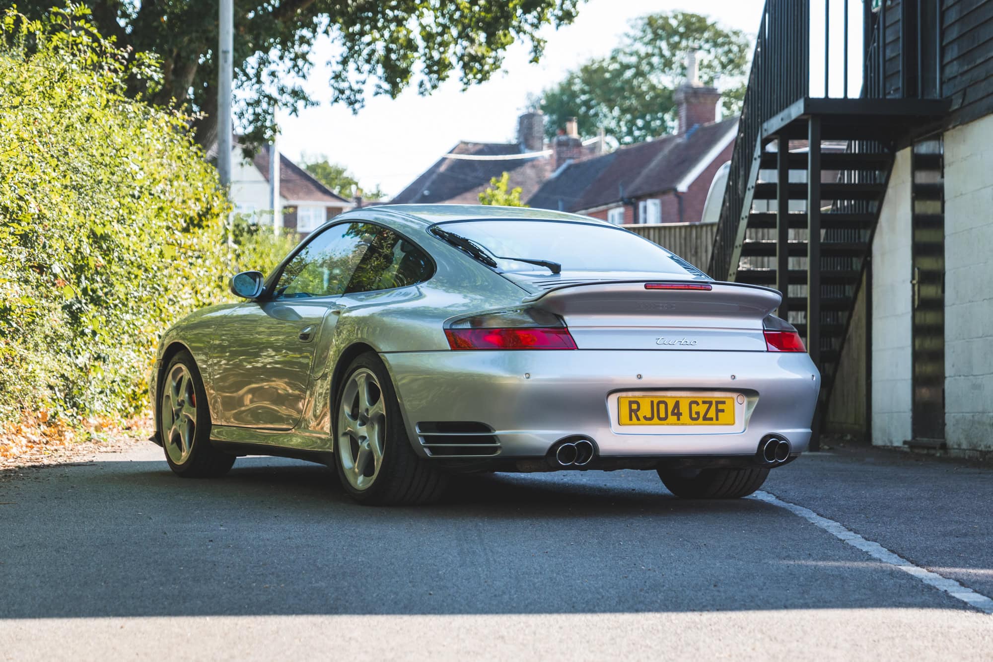 Rear view of a silver Porsche 996 Turbo.