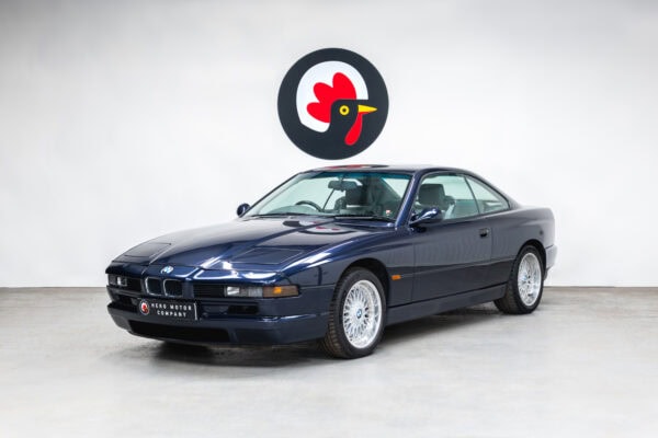 The front nearside quarter of a 1994 BMW 850 CSI coupe in orient blue metallic.