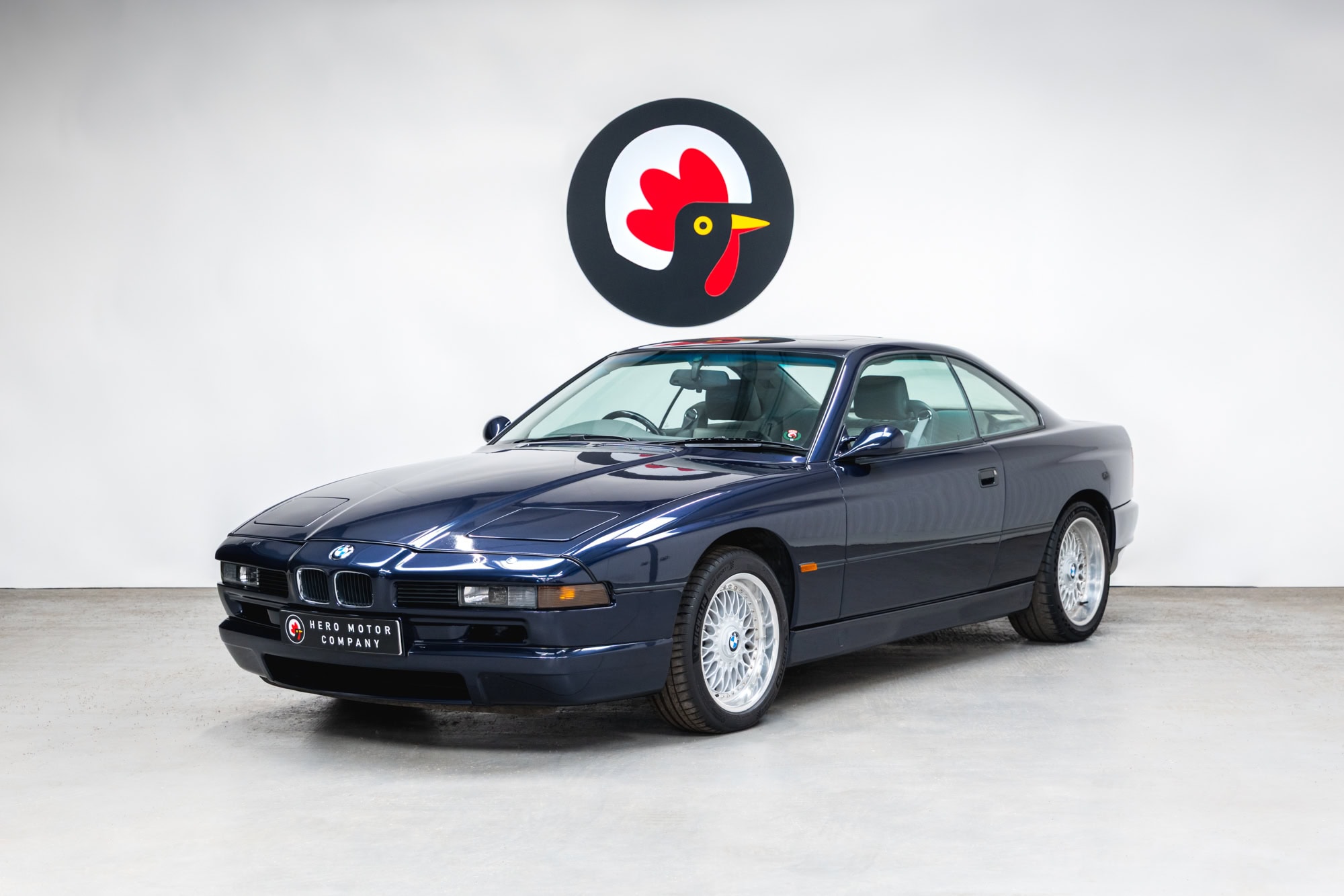 The front nearside quarter of a 1994 BMW 850 CSI coupe in orient blue metallic.