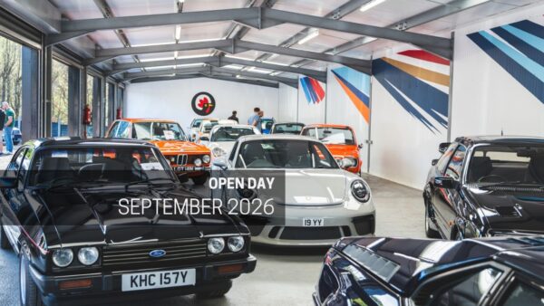 Classic and performance cars on display at an open day event.